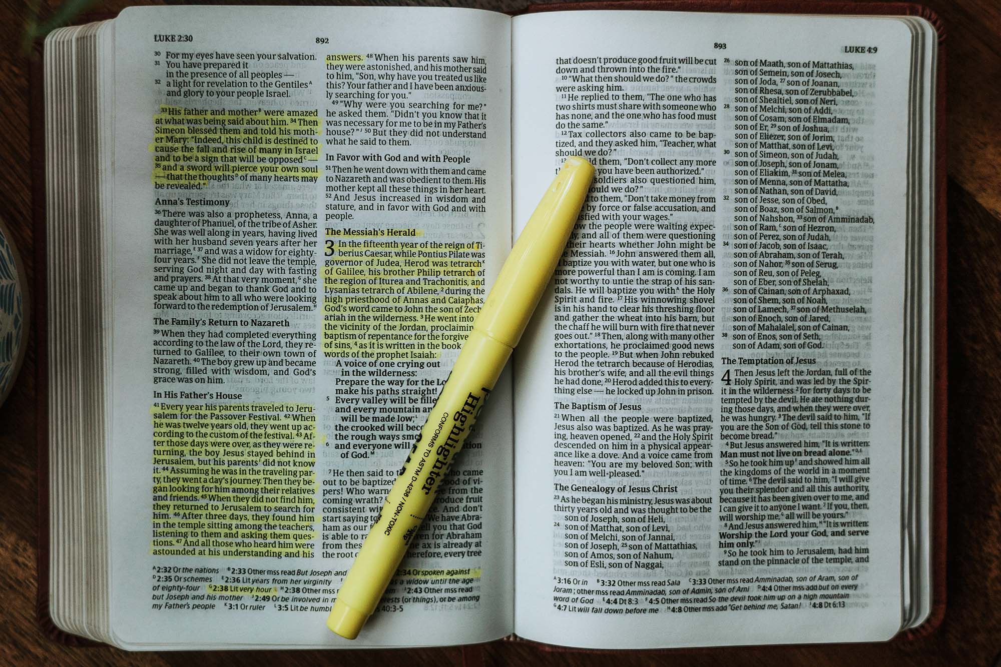 A Bible with highlighted scriptures in it.